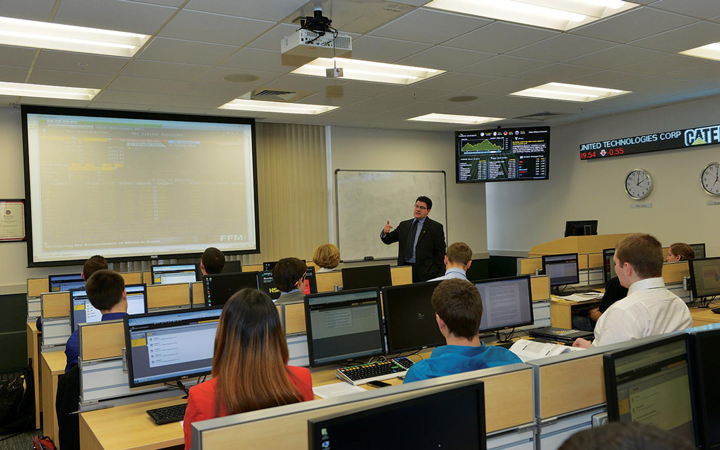 Professor Dewally teaches a class in the T. Rowe Price Finance Lab