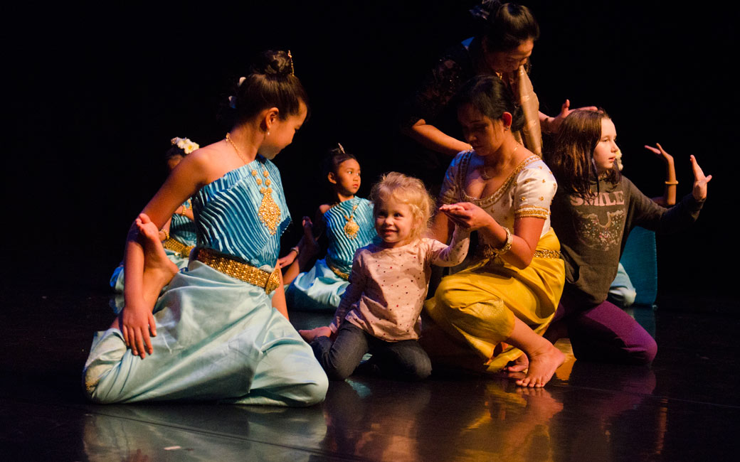 Dancers from the Cambodian American Heritage Dance Troupe work with children during Family Art Day, Nov. 2015