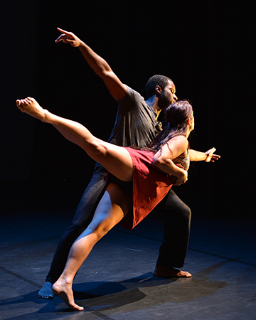 Two dancers mid-motion