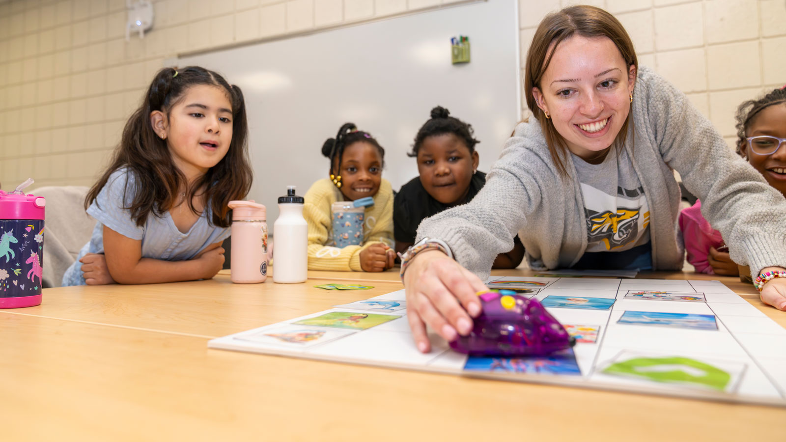 TU student teaching girls science skills