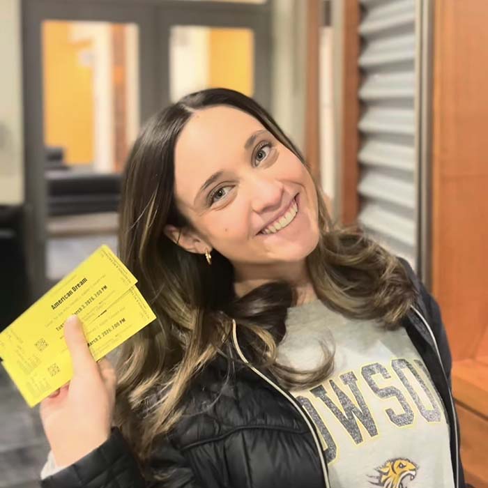 Students holding tickets to a show at the Center for the Arts