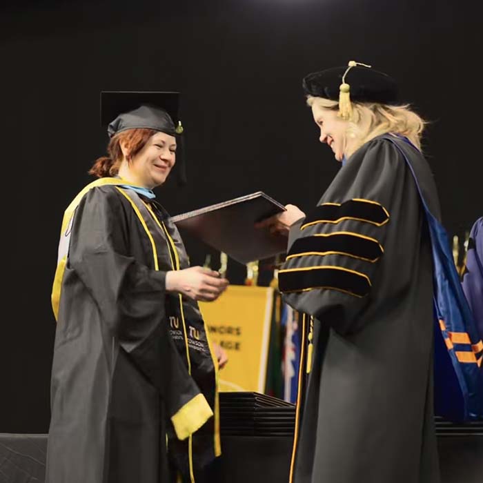 TU grad getting their degree