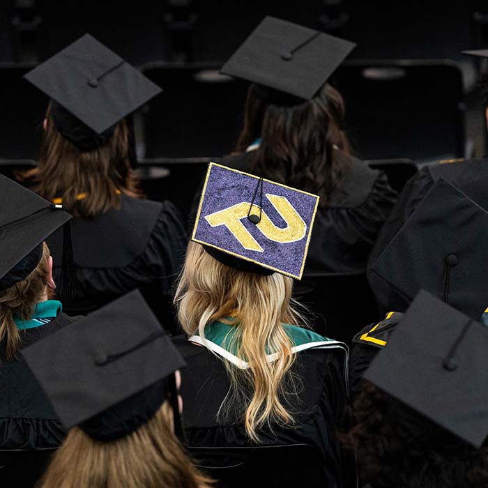 graduate cap with TU on it