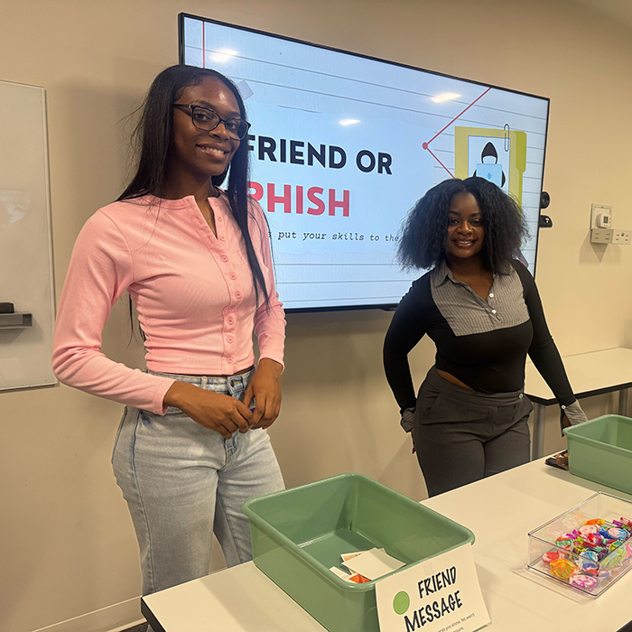 two people at the Cyber4all Center