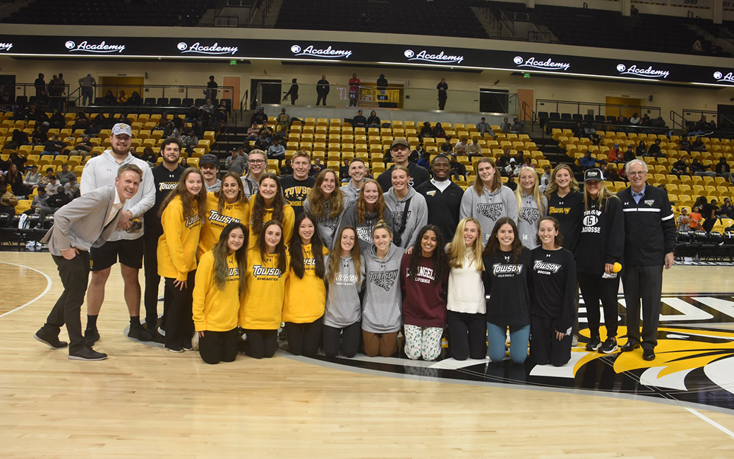 TU president Mark Ginsberg with TU student athletes