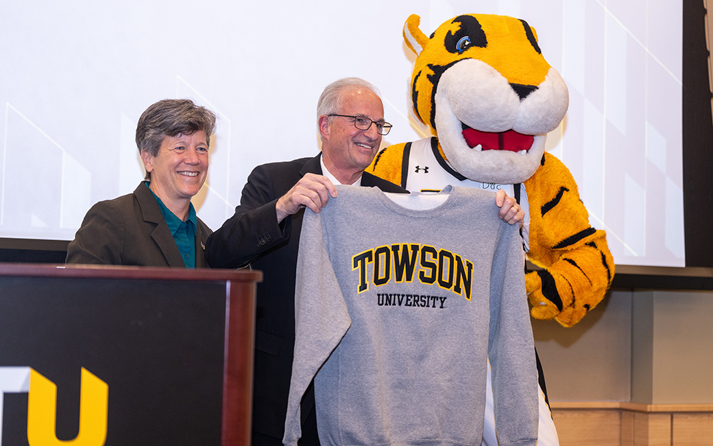 TU president Mark Ginsberg with provost Melanie Perreault and mascot Doc 