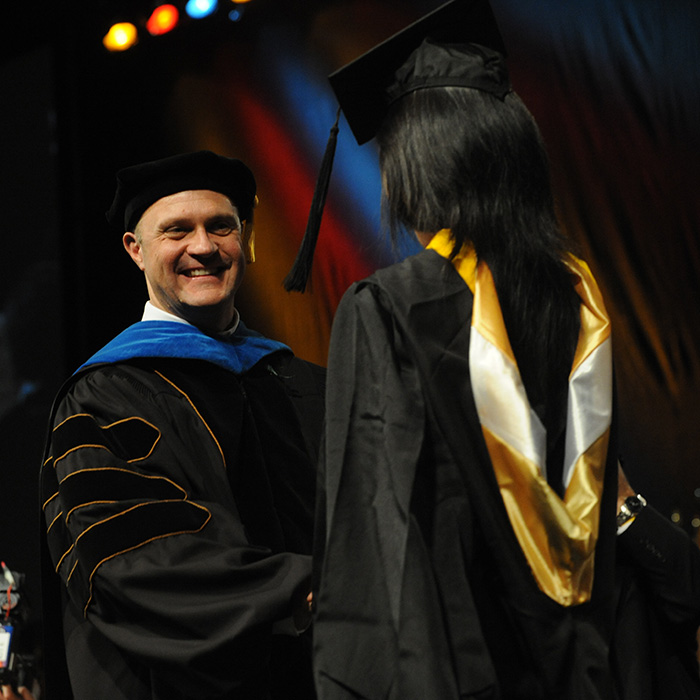 TU faculty member with a graduate