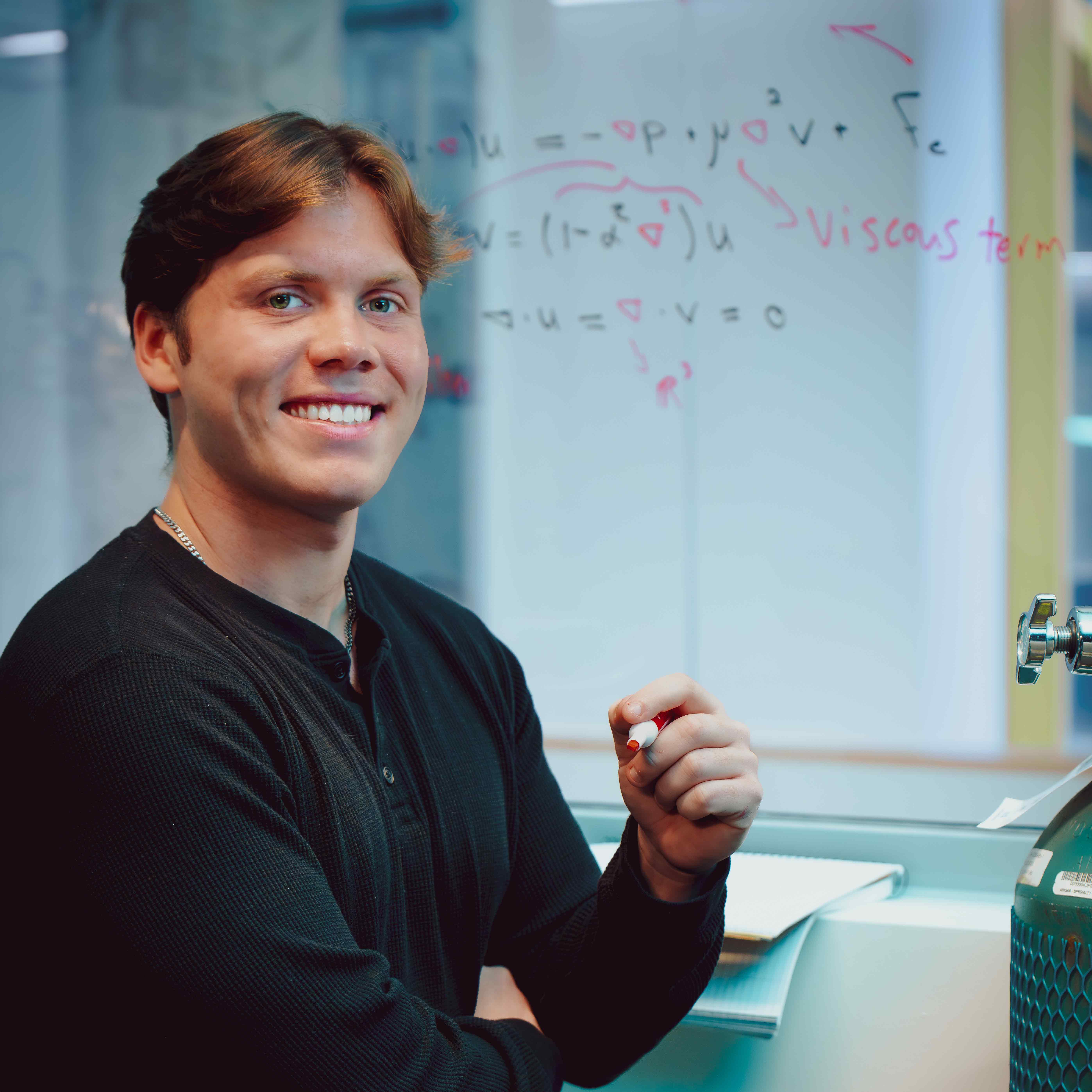 Student studying on white board