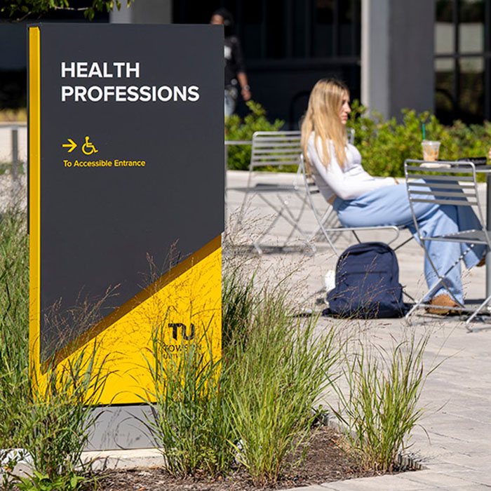 A TU branded sign shown on the campus