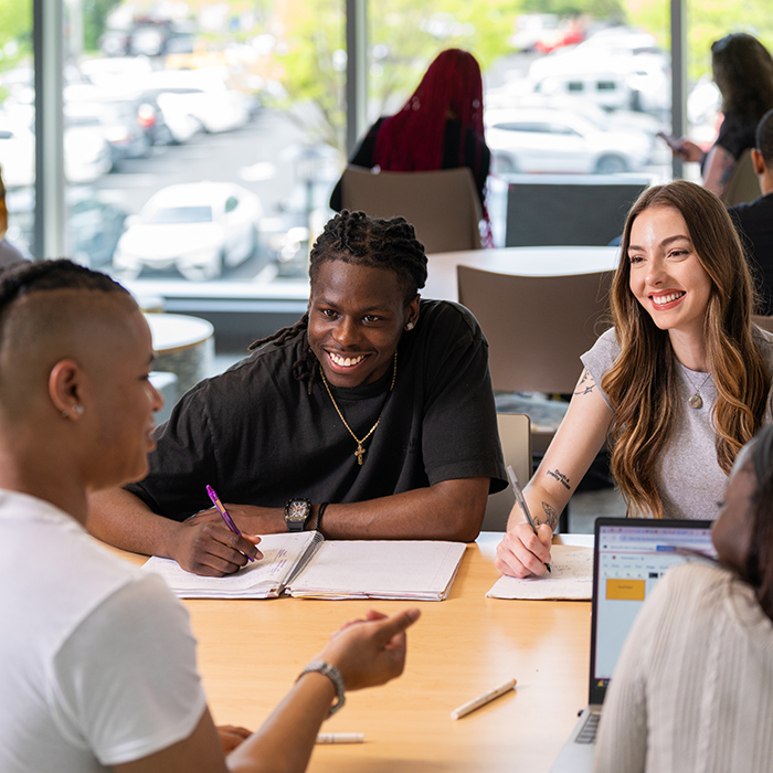 TU students sitting at a table