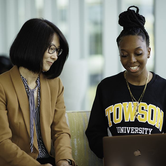 TU staff and mentor at a meeting