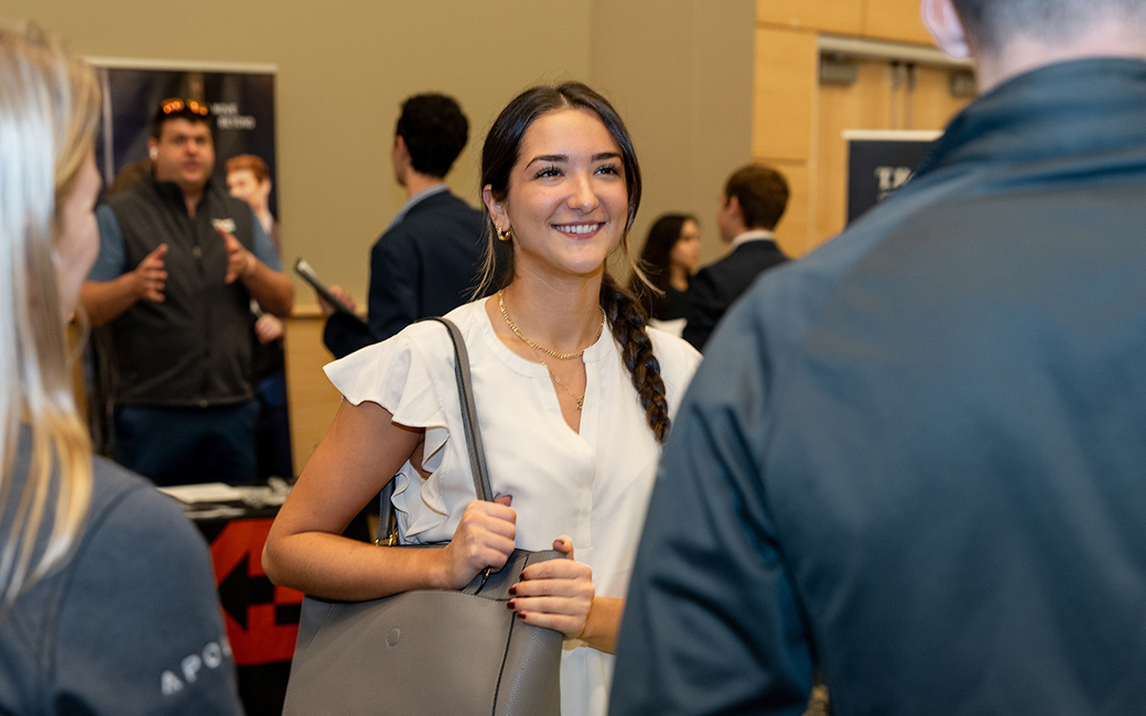 college of business and economics student talks to employer about internships at the CBE career fair