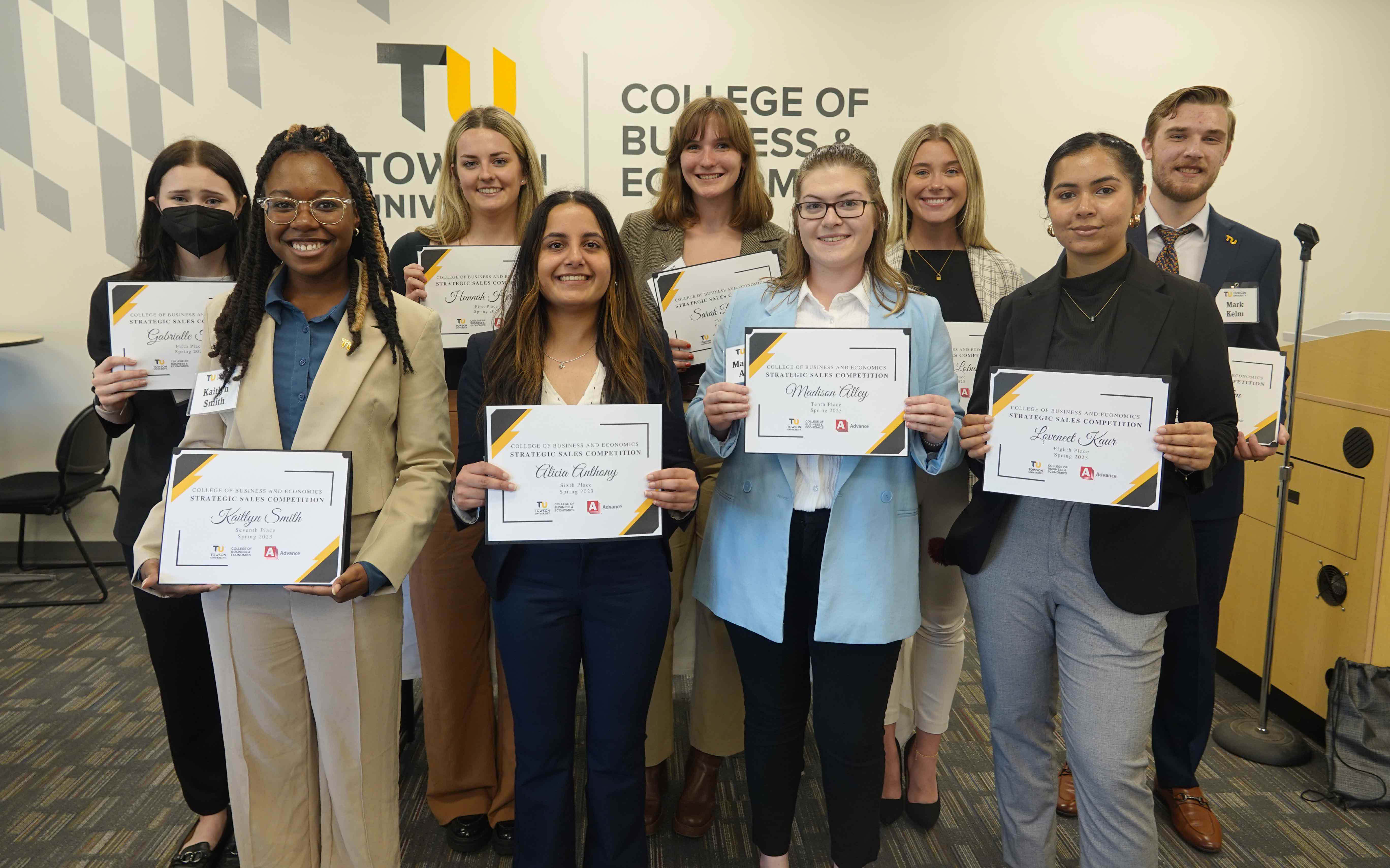 Students pose with their certificates