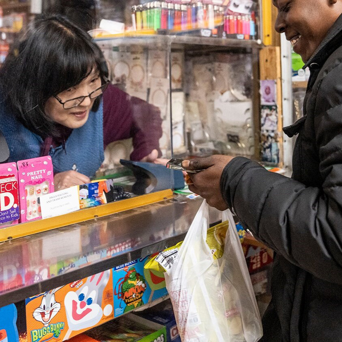 Behind the plexiglass: A corner store witnesses generations of love and loss in West Baltimore