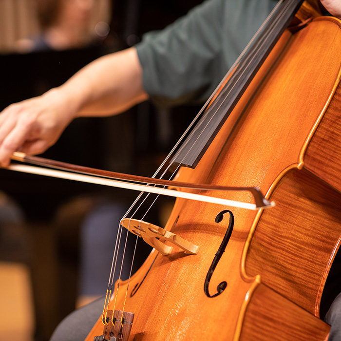 A student plays a cello