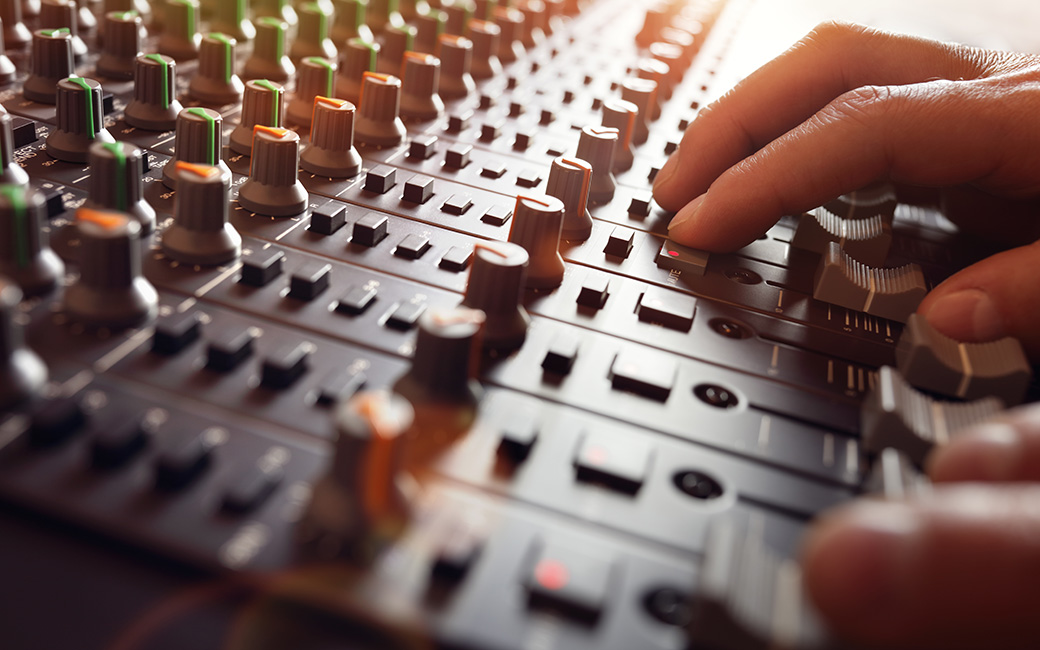 Person using a mixing console