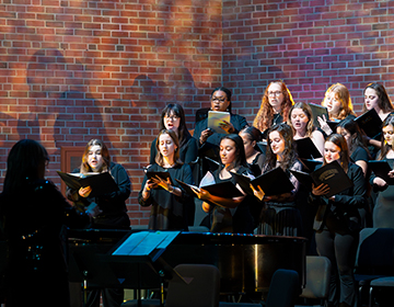 The University Chorale singing on stage