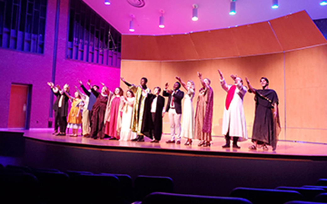 A Shakespearean medly performance ends, with everyone from Romans to witches to queens taking a bow onstage