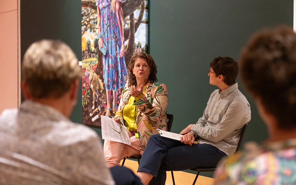 Joan Cox speaking in front of an audience