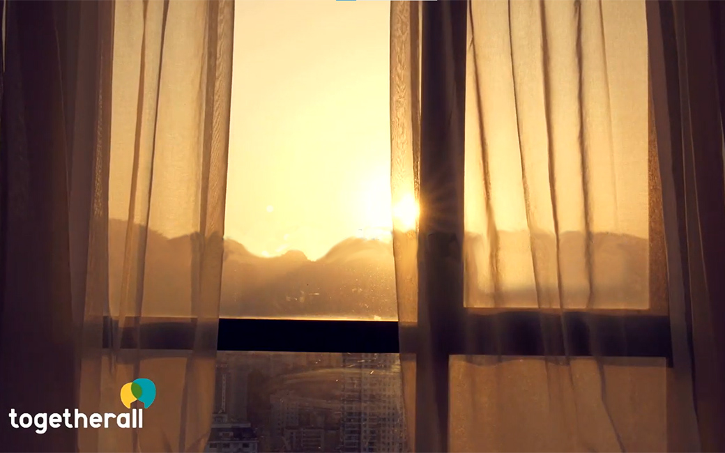 Together All logo, an image of an open window at sunset