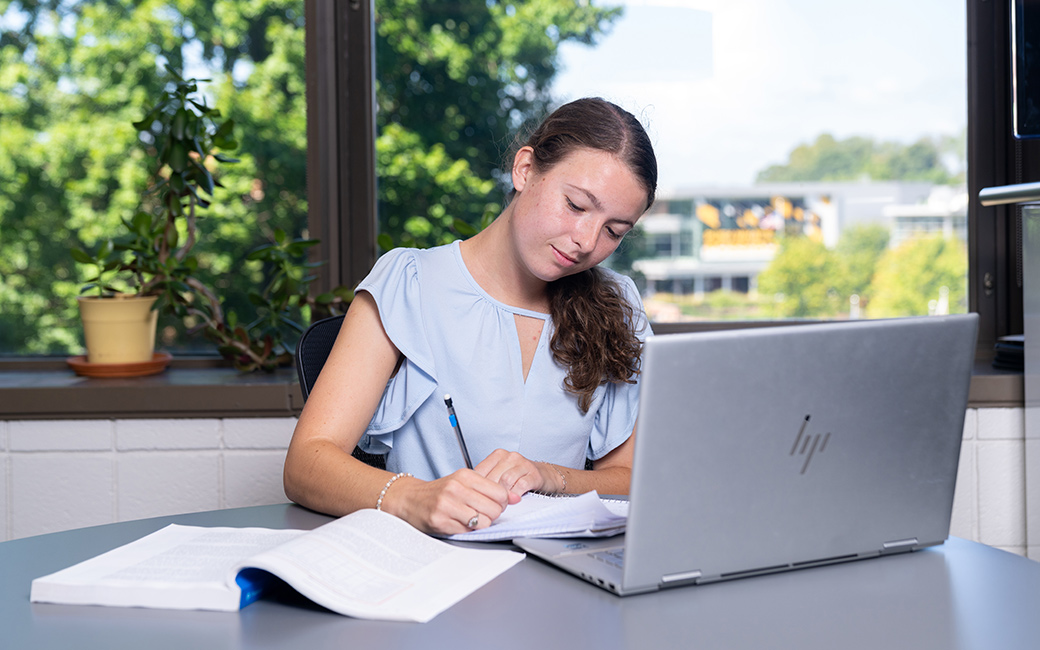 Student completing forms