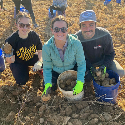 Alumni at a potato farm