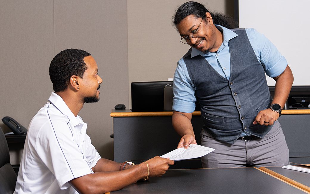 handing over a paper