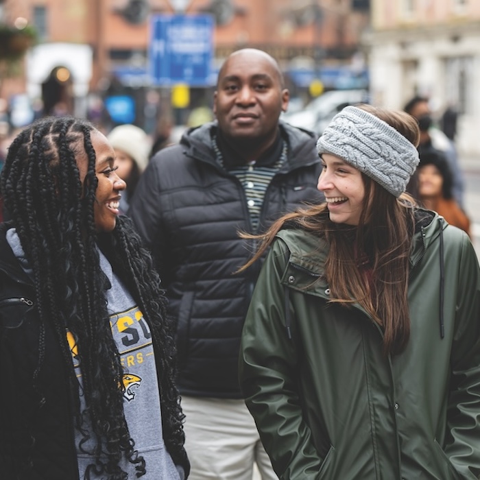 Students Sydney Howard and Faith Brennan with Jason Freeman in the background on the Black Heritage Walk in Birmingham.