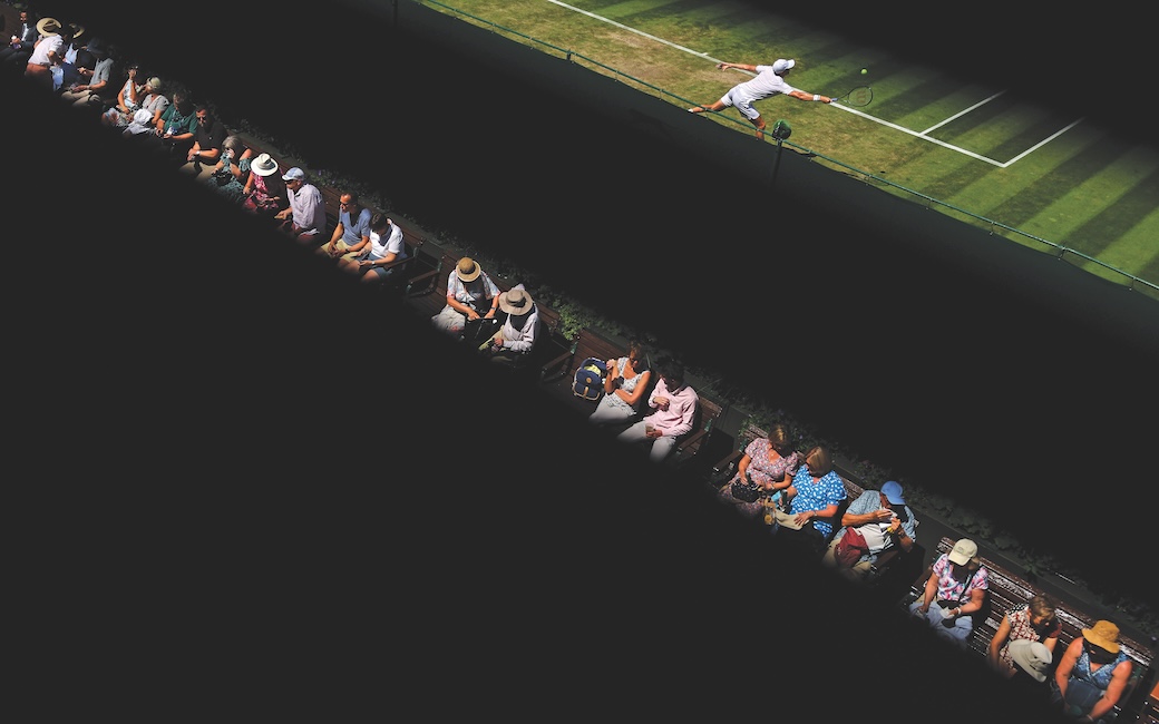 Crowd and player at Wimbledon separated by black lines