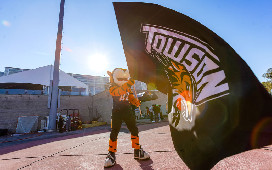 Doc waving Towson flag