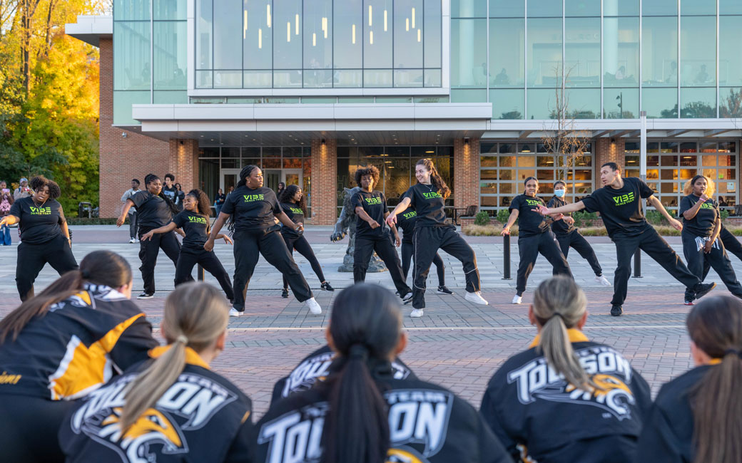 TU's Vibe Dance Team performs in front of the Union during the Parade