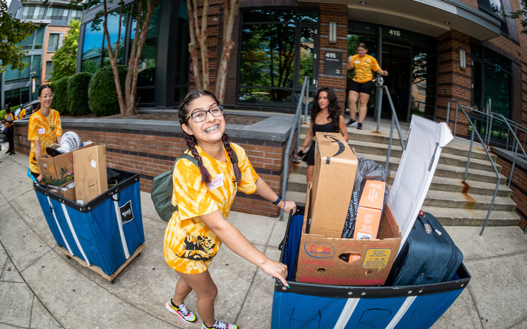 Student moving into a residence hall with dorm