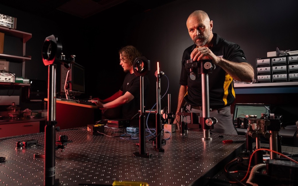 Dr. Jeff Simpson and student, Jacob Buchman, at work in TU's Spectroscopy lab. 