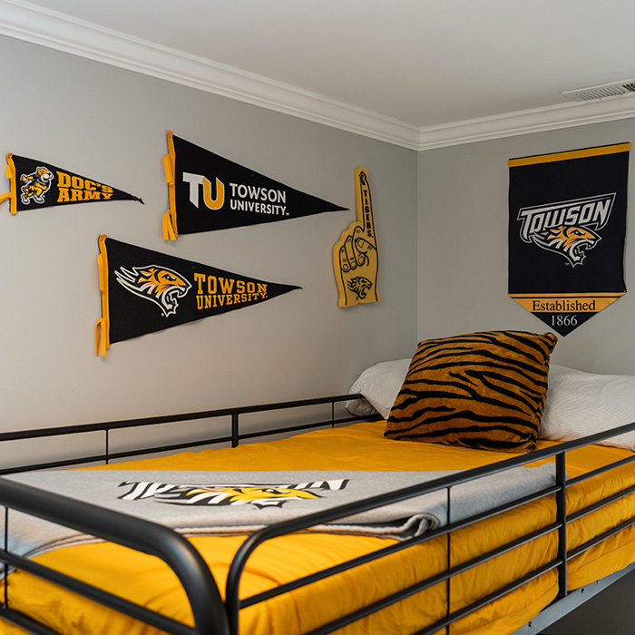 Bedroom adorned with Towson University decorations 