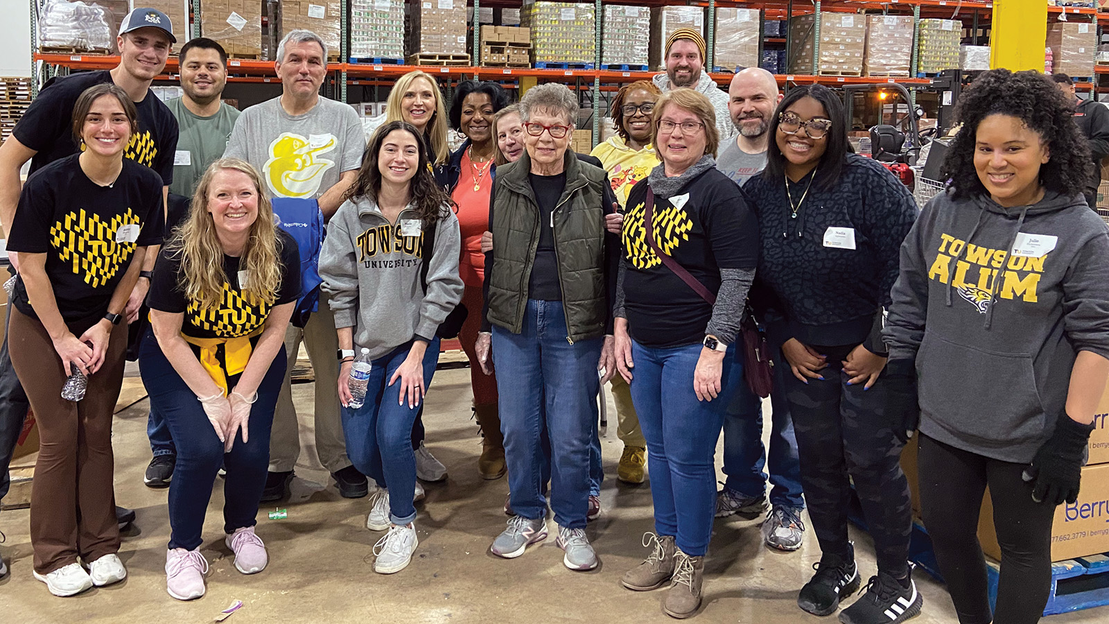 TU alumni posing for a group photo at the Maryland Food Bank