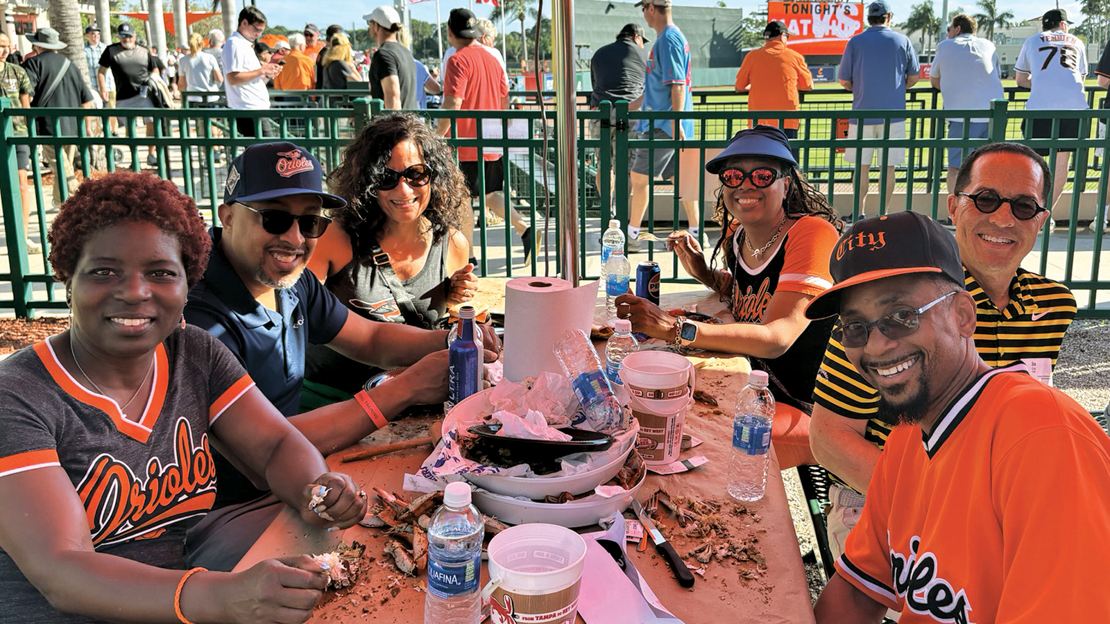 TU alumni eating crabs at the O's game