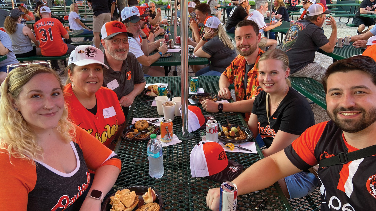 Guests enjoy a cookout in the Bull Pen Picnic Grove ahead of the game. 