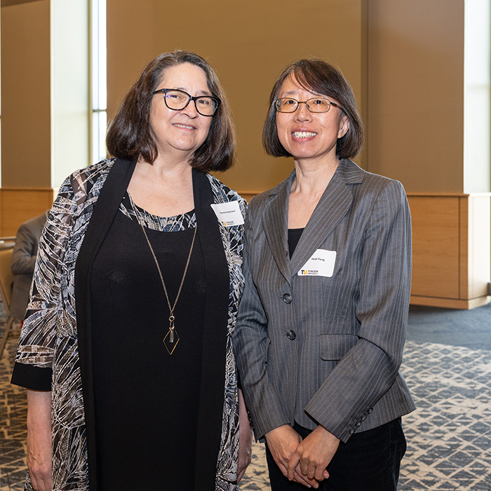 Connie Anderson and Heidi Feng