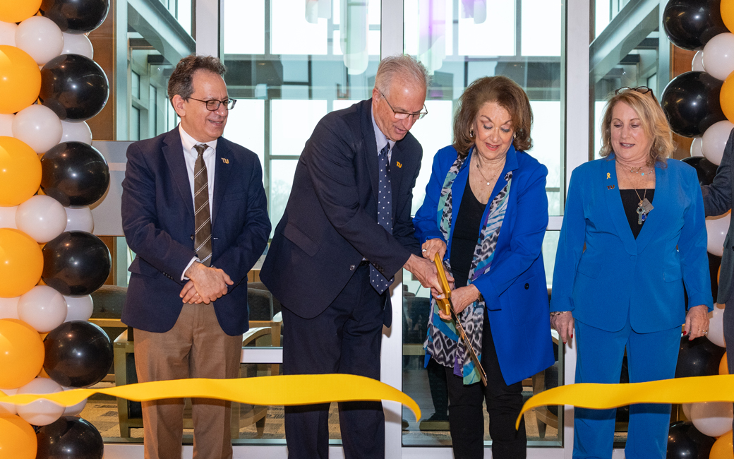 President Ginsberg and faculty cutting ribbon to Sandra R. Berman Center