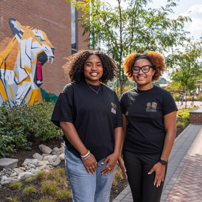 Leaders of Bettering Black Minds stand for a portrait outside of the Union