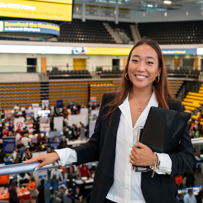 Student poses at Mega Internship & Job Fair in TU Arena