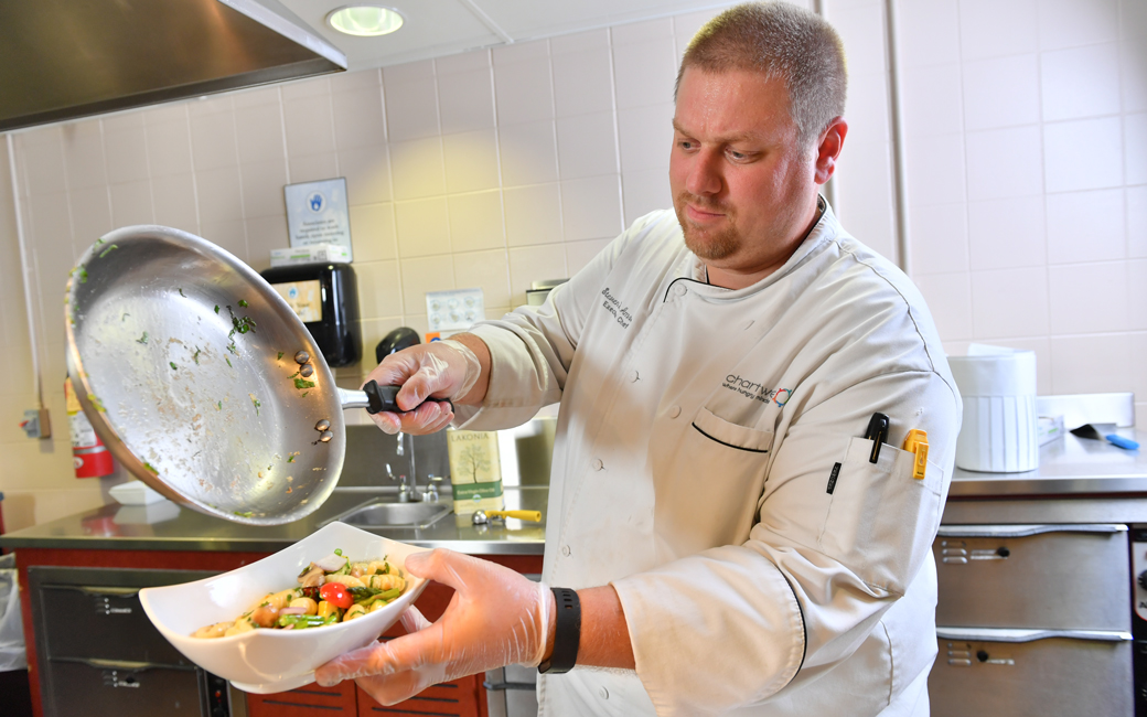 Chef Steve Amrein plating vegetables