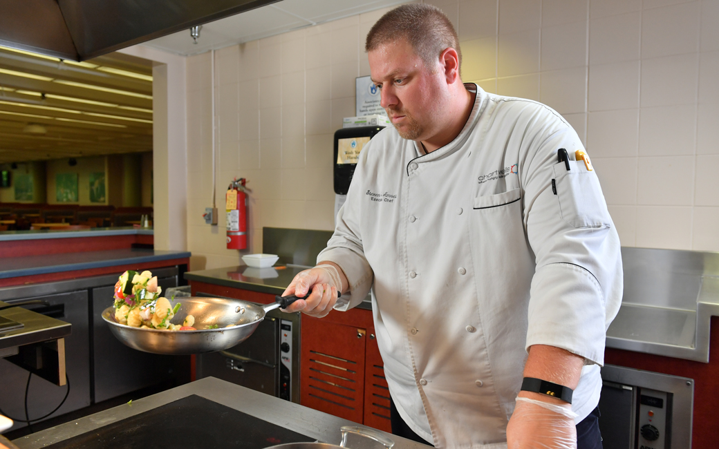 Chef Steve Amrein sautéing vegetables 