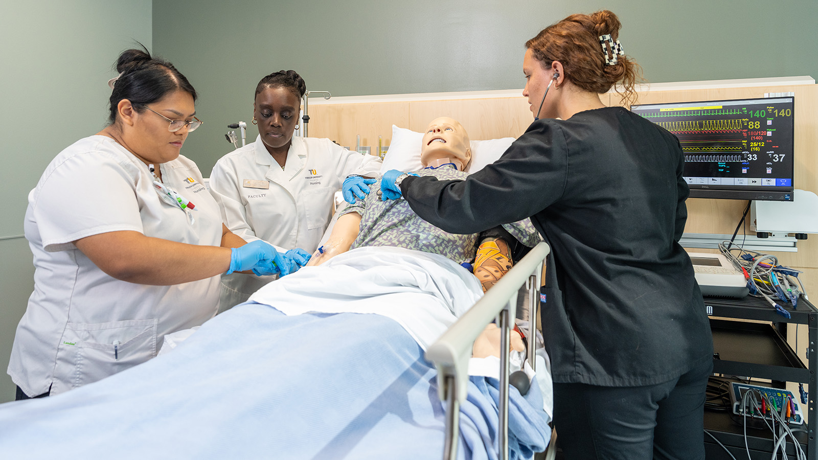 Simulation center in the Health Processions building in which students practice emergency care on a dummy