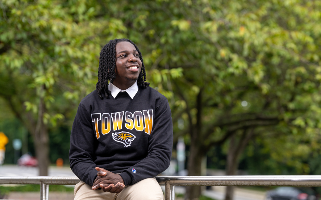 Edmund Rhynes sitting on campus