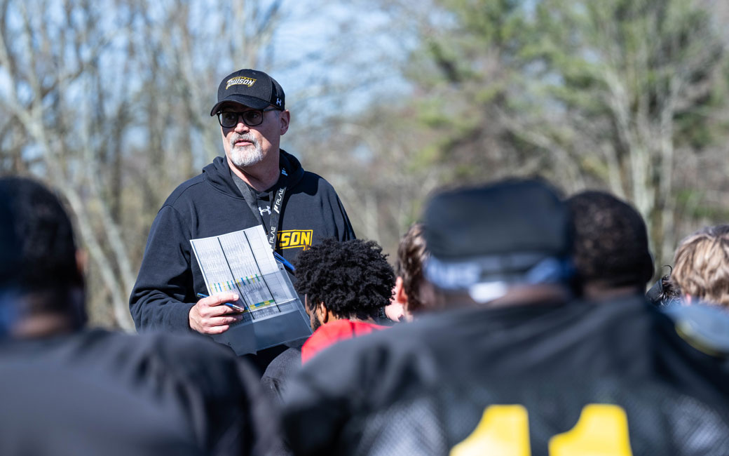 Towson Football Coach Pete Shinnick with the team at practice