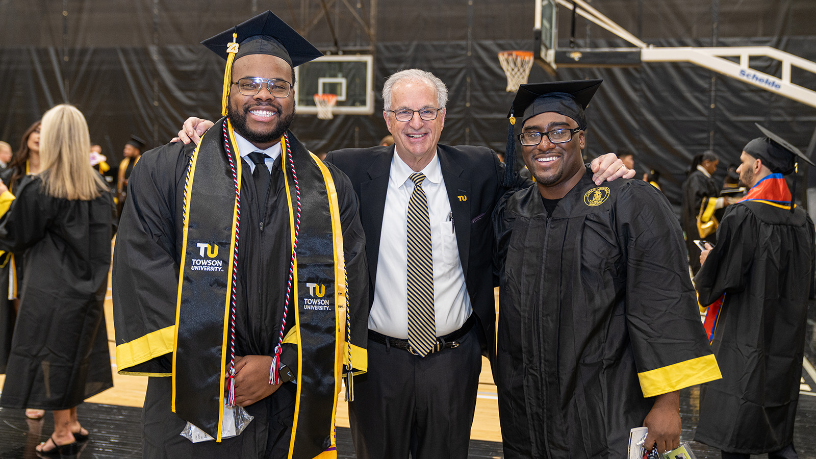 President Ginsberg and two TU graduates