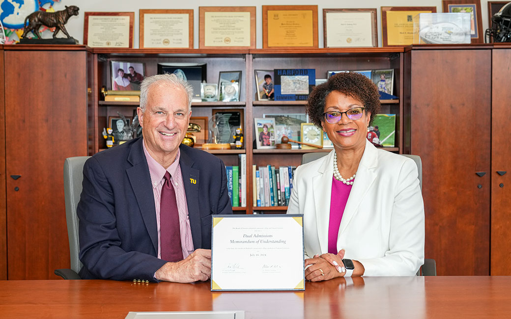 President Ginsberg and President Felder next to the Memorandum of Understanding