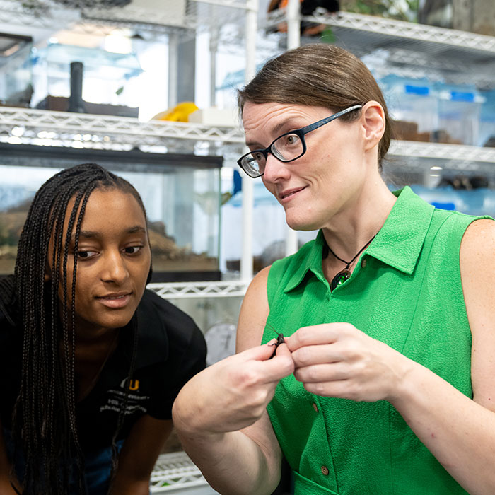 Faith Weeks teaching student about insects