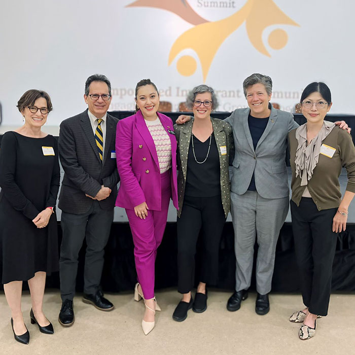 Group of faculty and staff at immigration summit